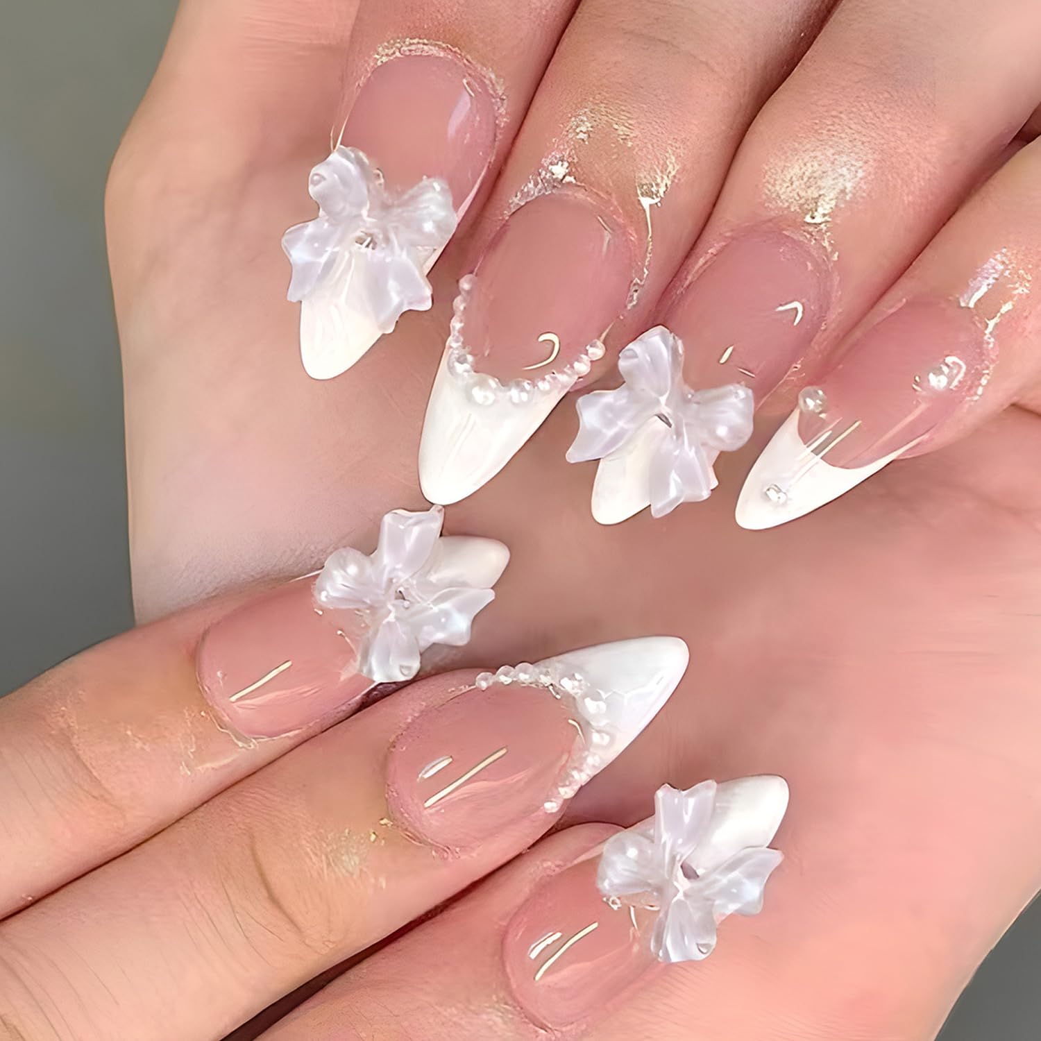 Reusable press on nails set with 144 pieces featuring cute bow nail designs in multiple sizes for easy at-home manicures.